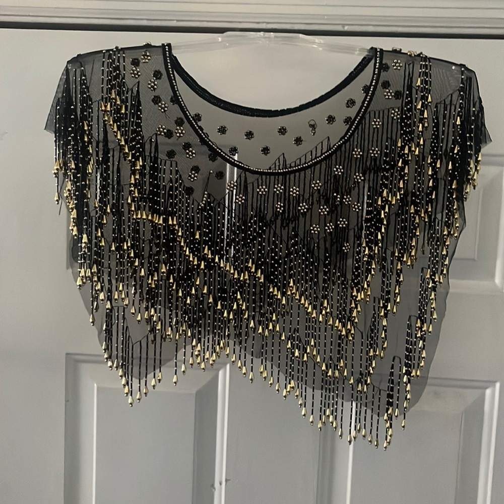 Vintage sheer shirt. Pair with a cute skirt or jeans!